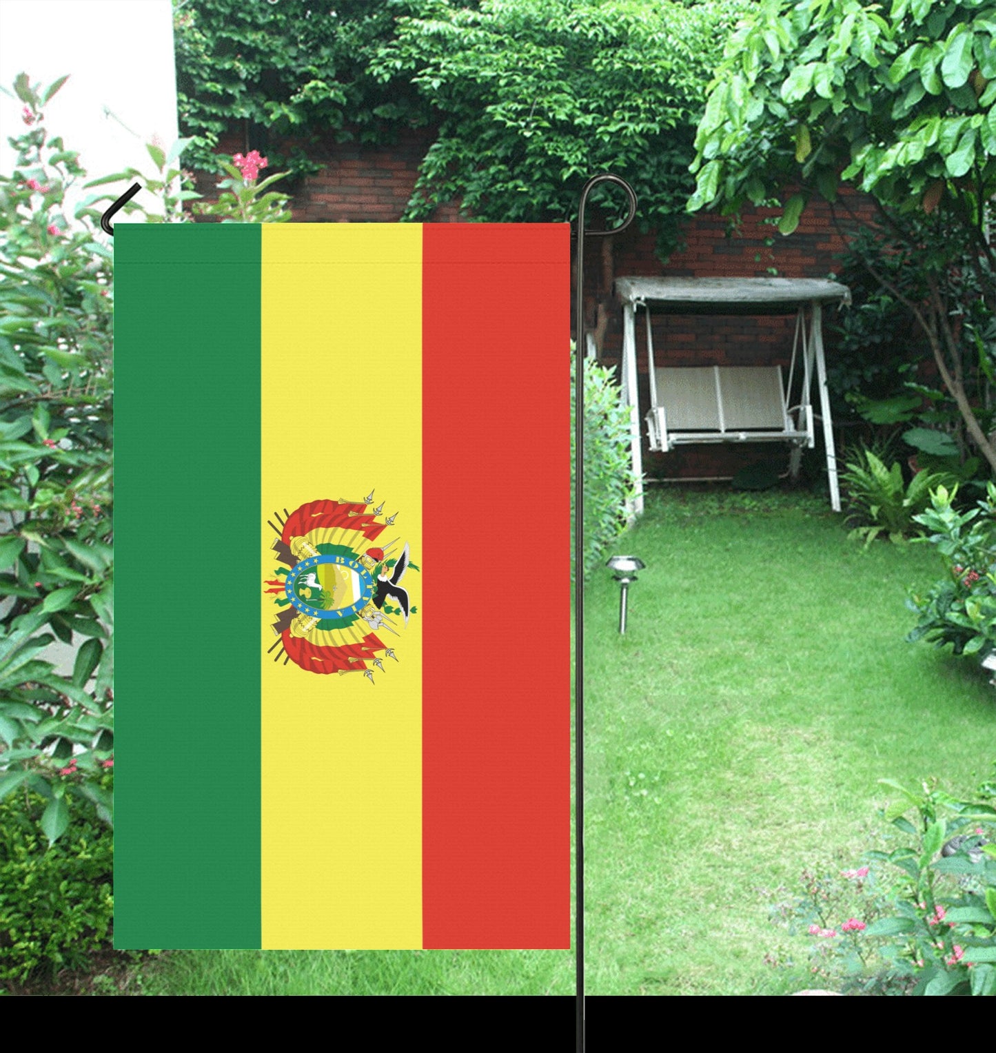 Luv My Flag: Bolivian flag displayed in a garden.