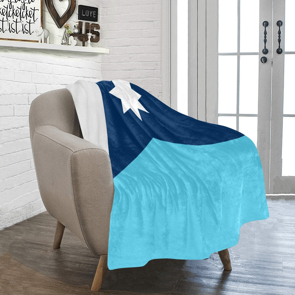 Cozy chair with Luv My Flag starry blanket draped.