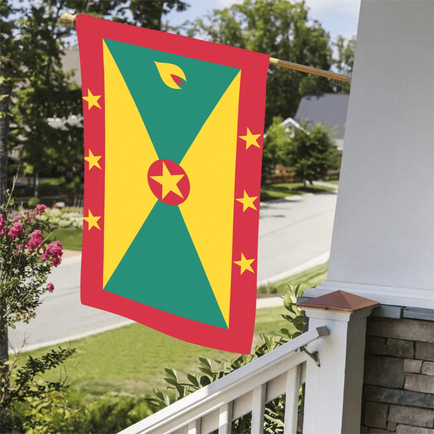 House displaying a vibrant Grenada flag by Luv My Flag.