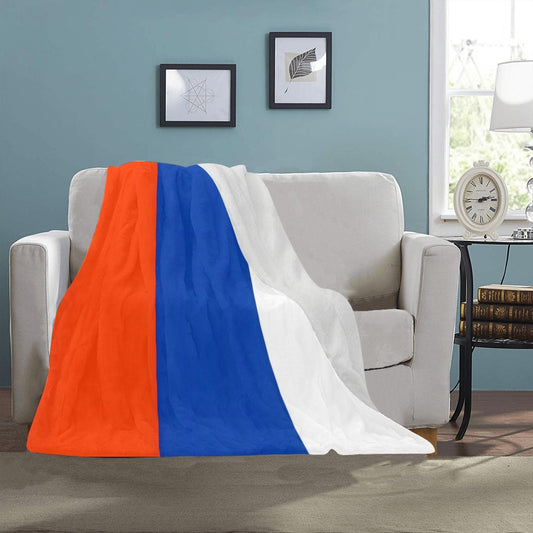 "Luv My Flag throw blanket draped over a sofa."