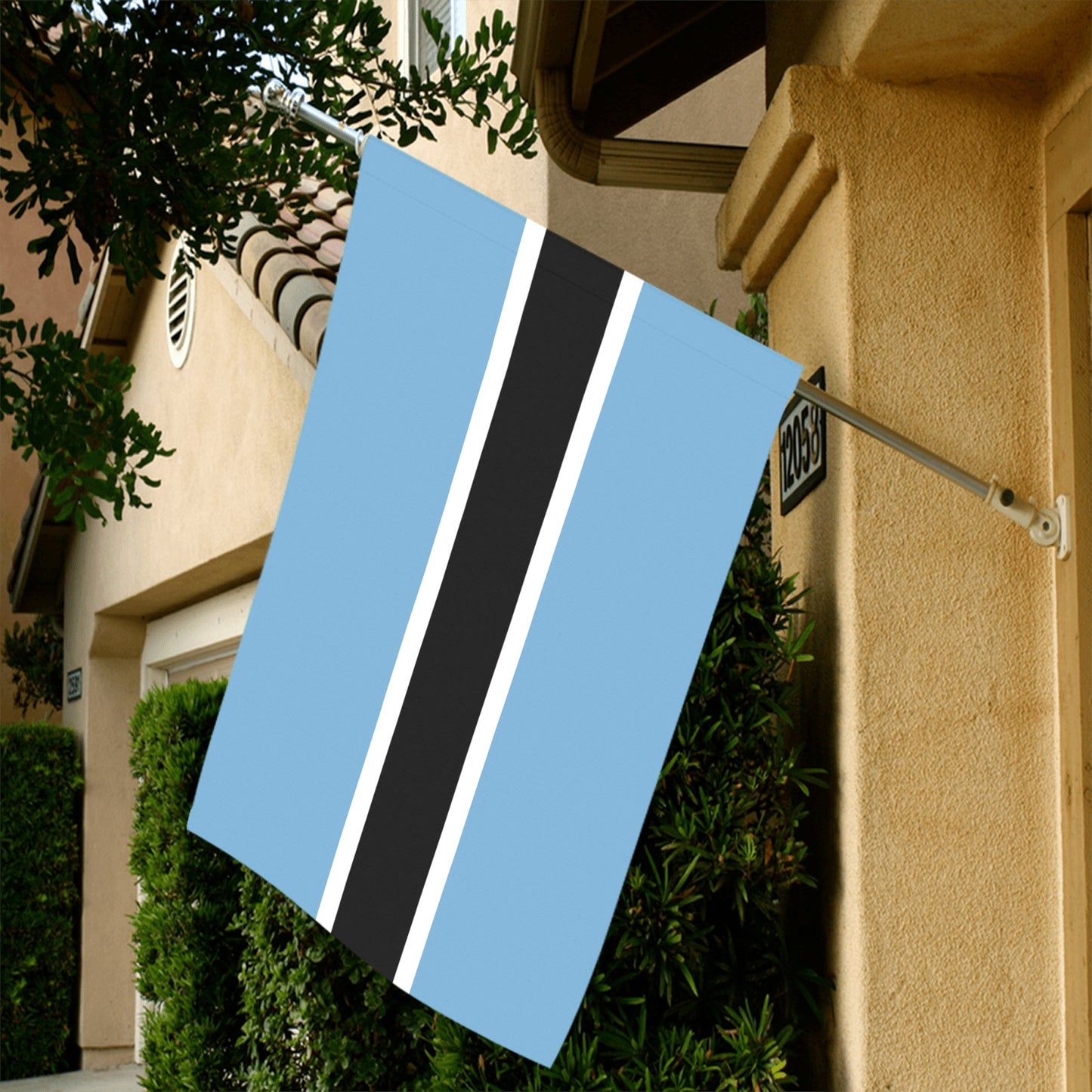 Luv My Flag blue-black-white flag displayed on house.