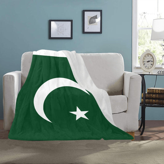 Luv My Flag blanket featuring Pakistan flag on sofa.