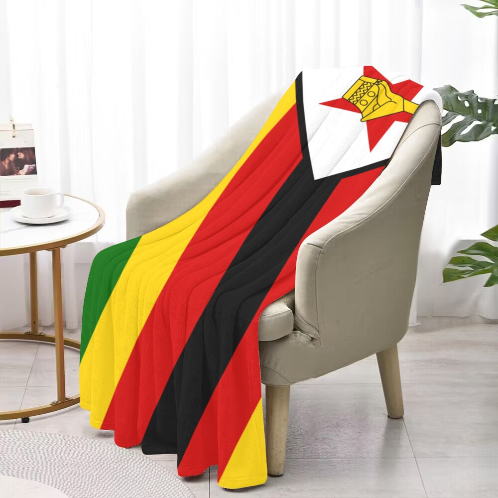 Luv My Flag Zimbabwe blanket draped over beige armchair.