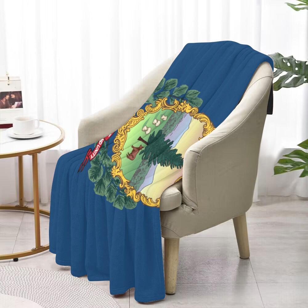 Luv My Flag blanket on chair with colorful design.