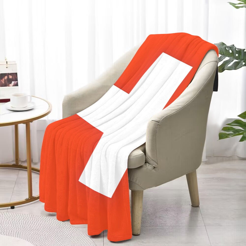 Red and white blanket on chair, by Luv My Flag.