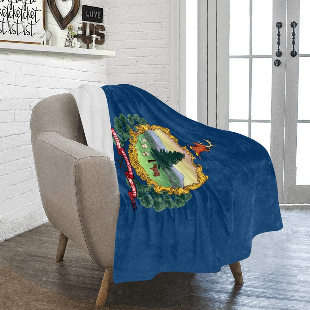 Cozy chair with Luv My Flag Vermont blanket draped.