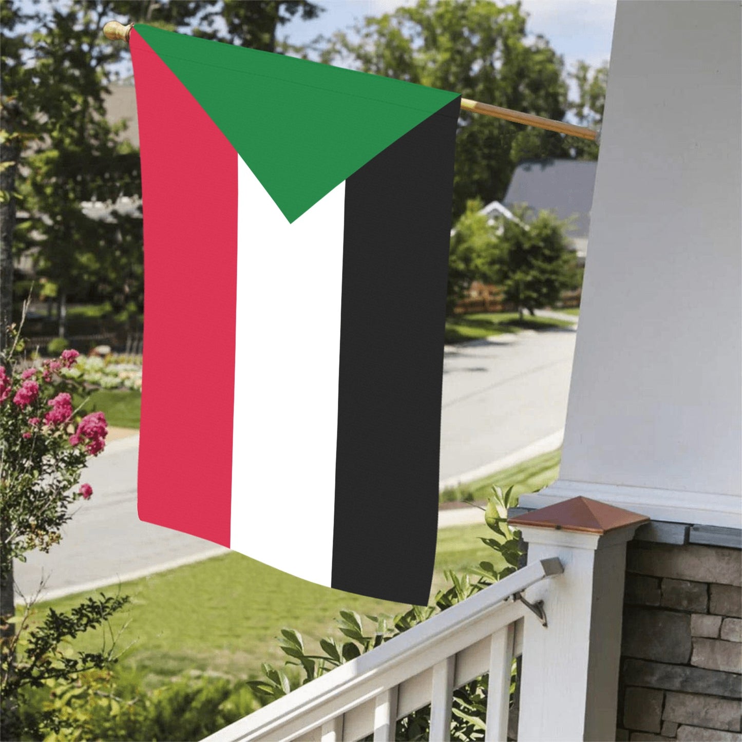 Luv My Flag's Sudanese flag displayed on porch railing.