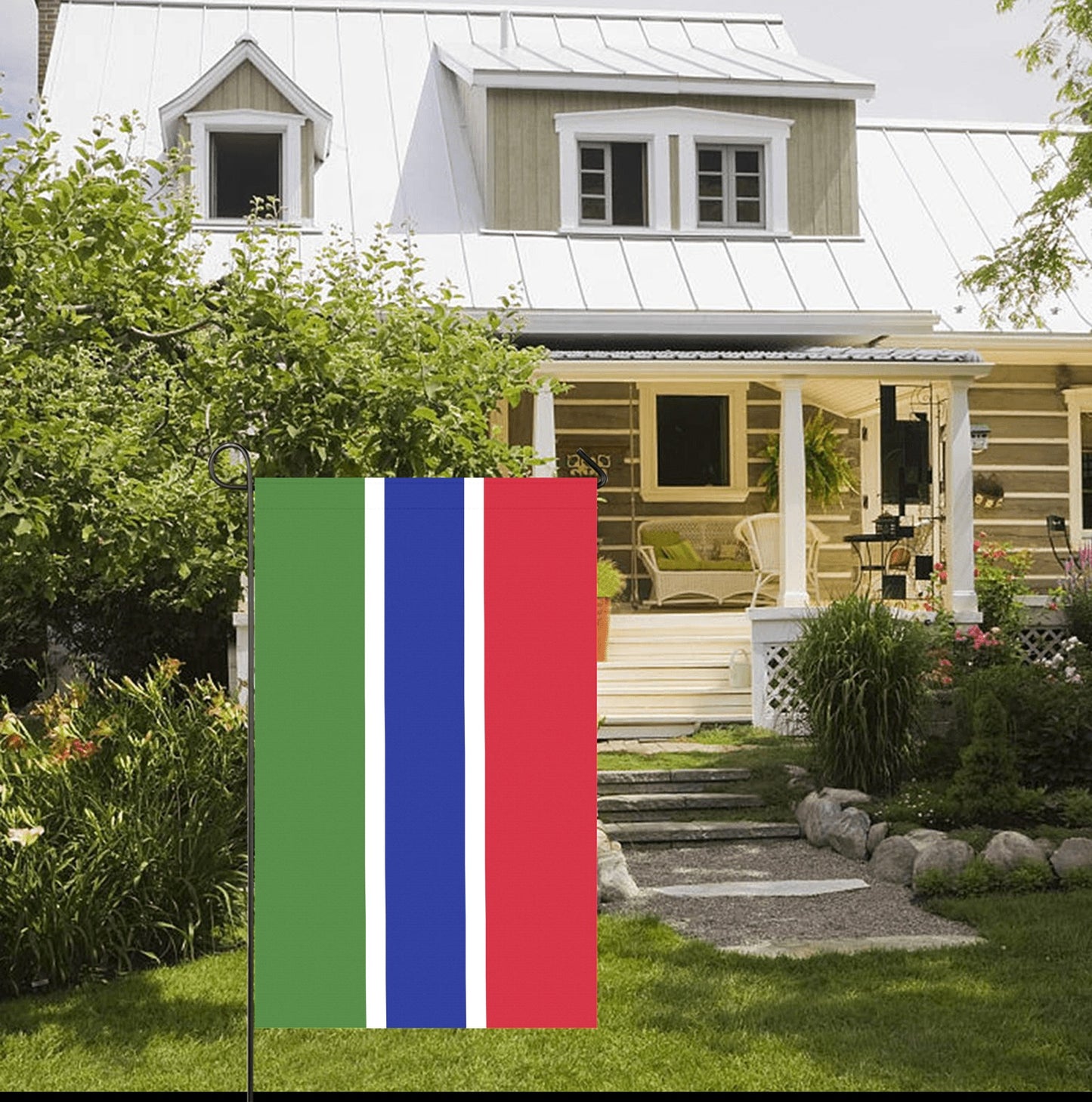 Garden flag by Luv My Flag displayed near cottage.