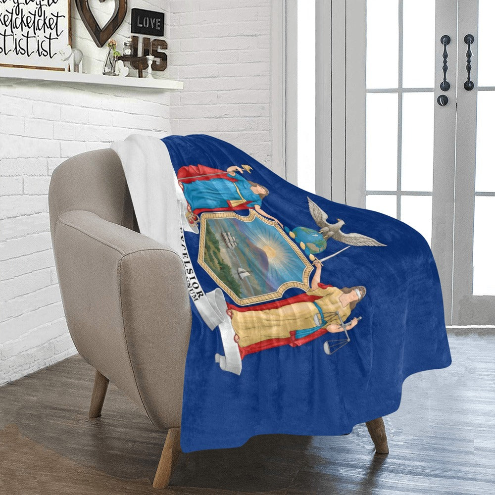 Cozy armchair draped with Luv My Flag state blanket.