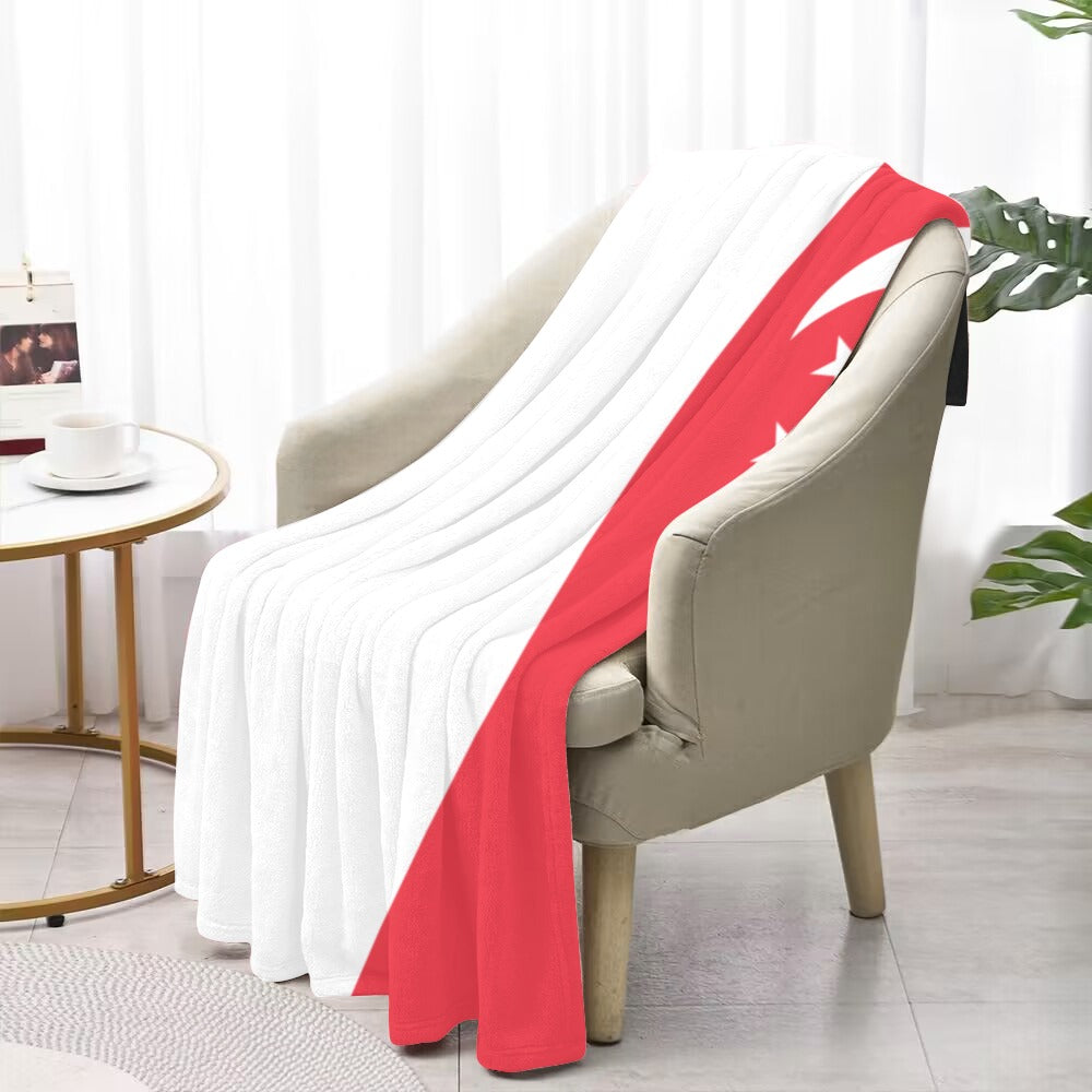 Luxurious chair with Luv My Flag Singapore blanket draped.