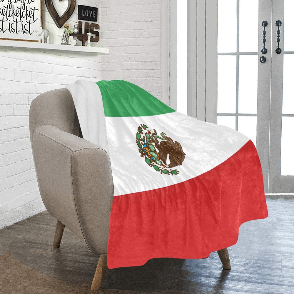 Luv My Flag Mexican flag blanket on gray armchair.