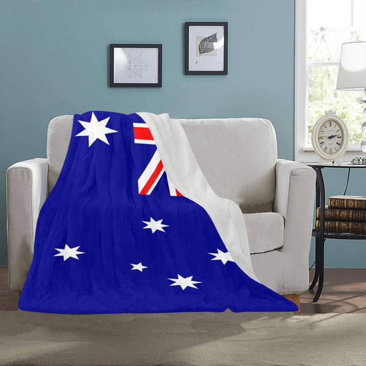 Luv My Flag Australian-themed blanket draped over beige sofa.