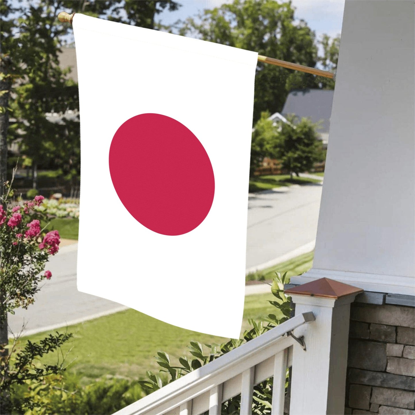 Luv My Flag Japan flag displayed on porch railing.