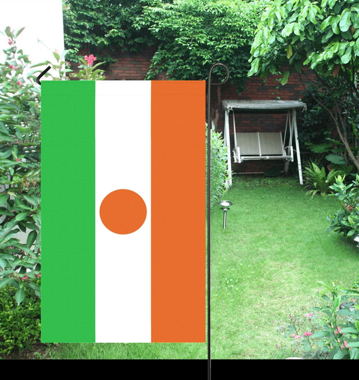 Garden with Luv My Flag garden flag, vibrant colors.