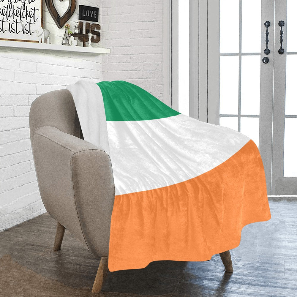 Luv My Flag throw blanket draped over beige armchair.