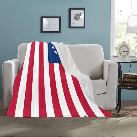 Cozy sofa adorned with Luv My Flag patriotic blanket.