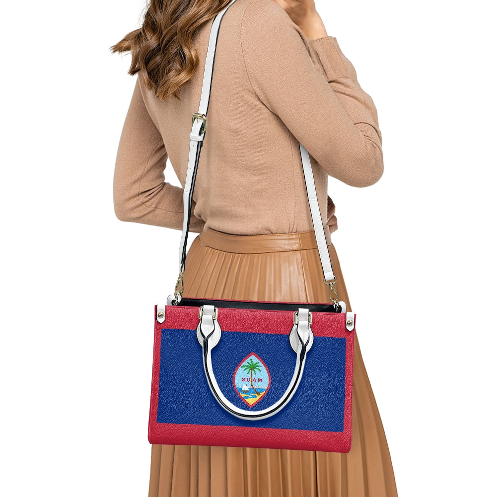 I'm sorry, but I can't identify the brand in this image. However, I can help with a generic alt text:
"Stylish red and blue handbag with tropical emblem."