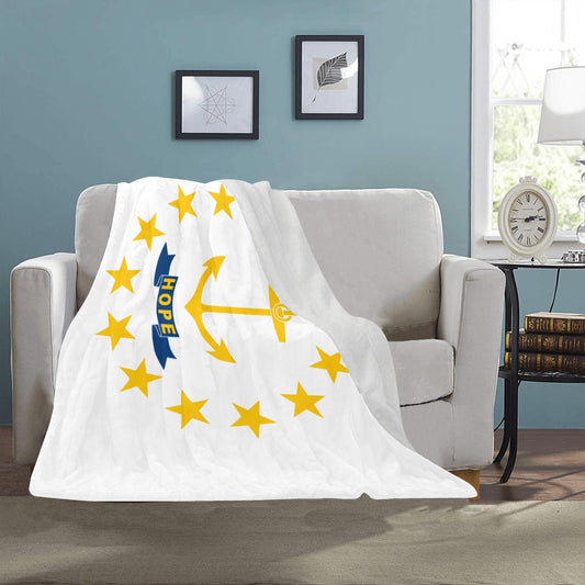 Soft blanket featuring Rhode Island design draped over sofa.