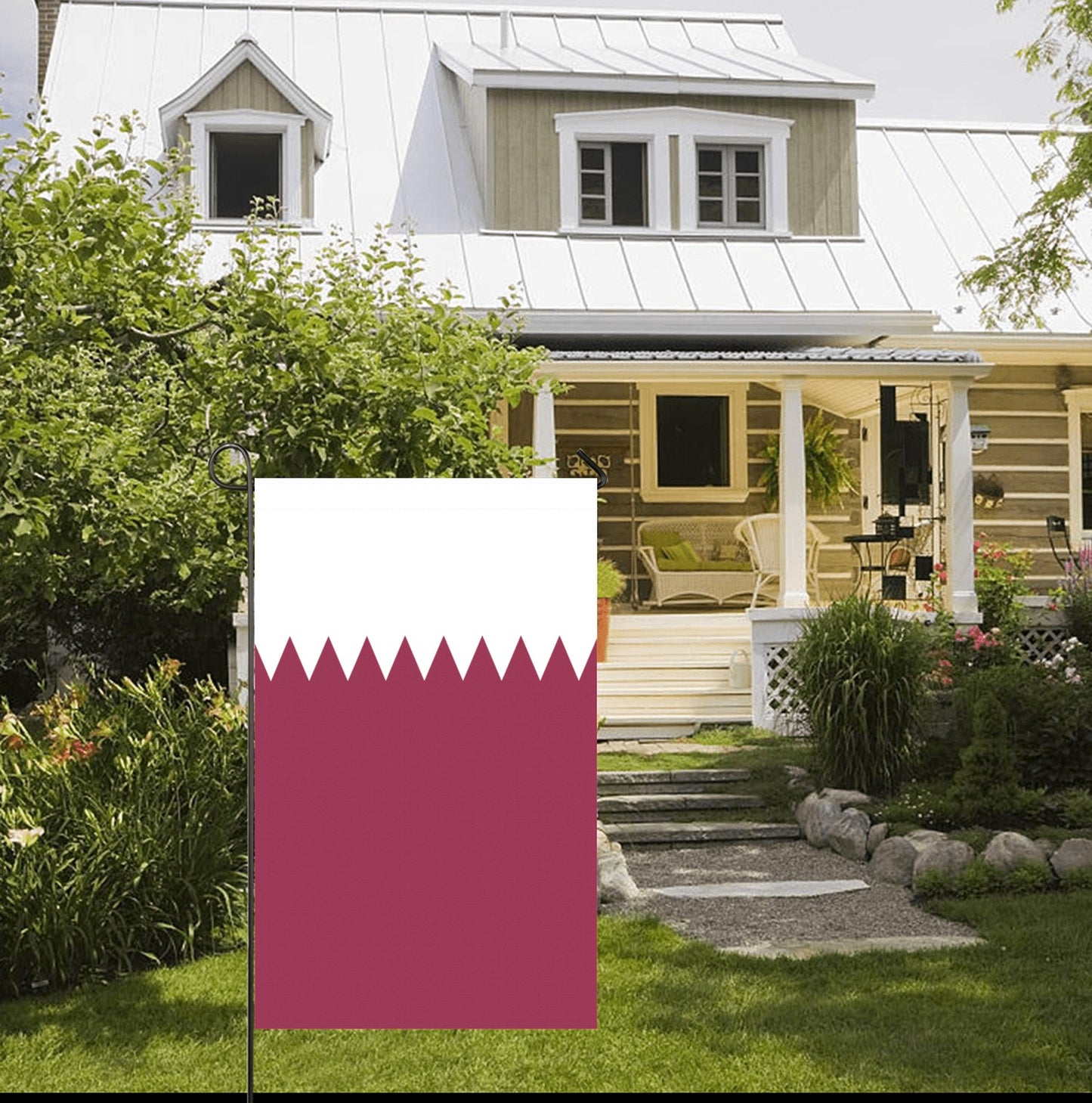 House with porch, garden, and Luv My Flag displayed outside.