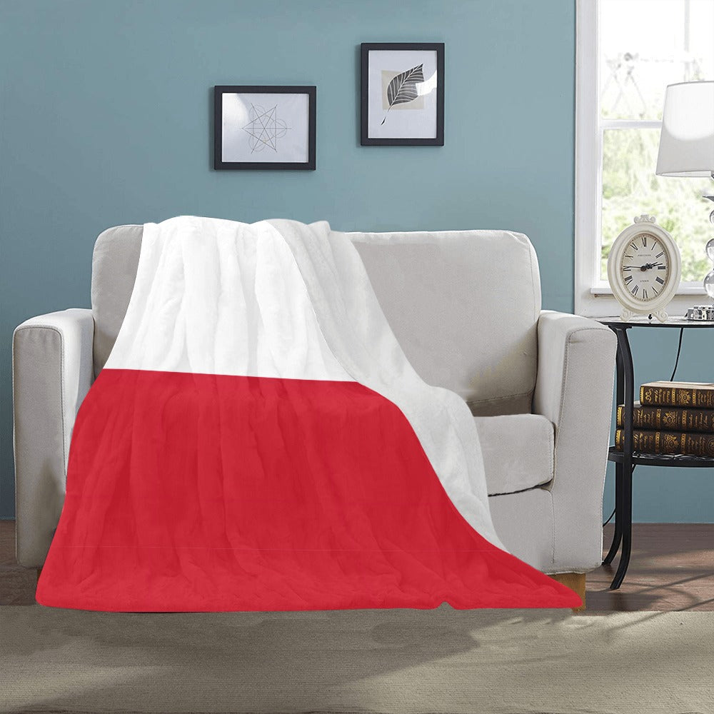 Cozy Luv My Flag blanket on a beige sofa.