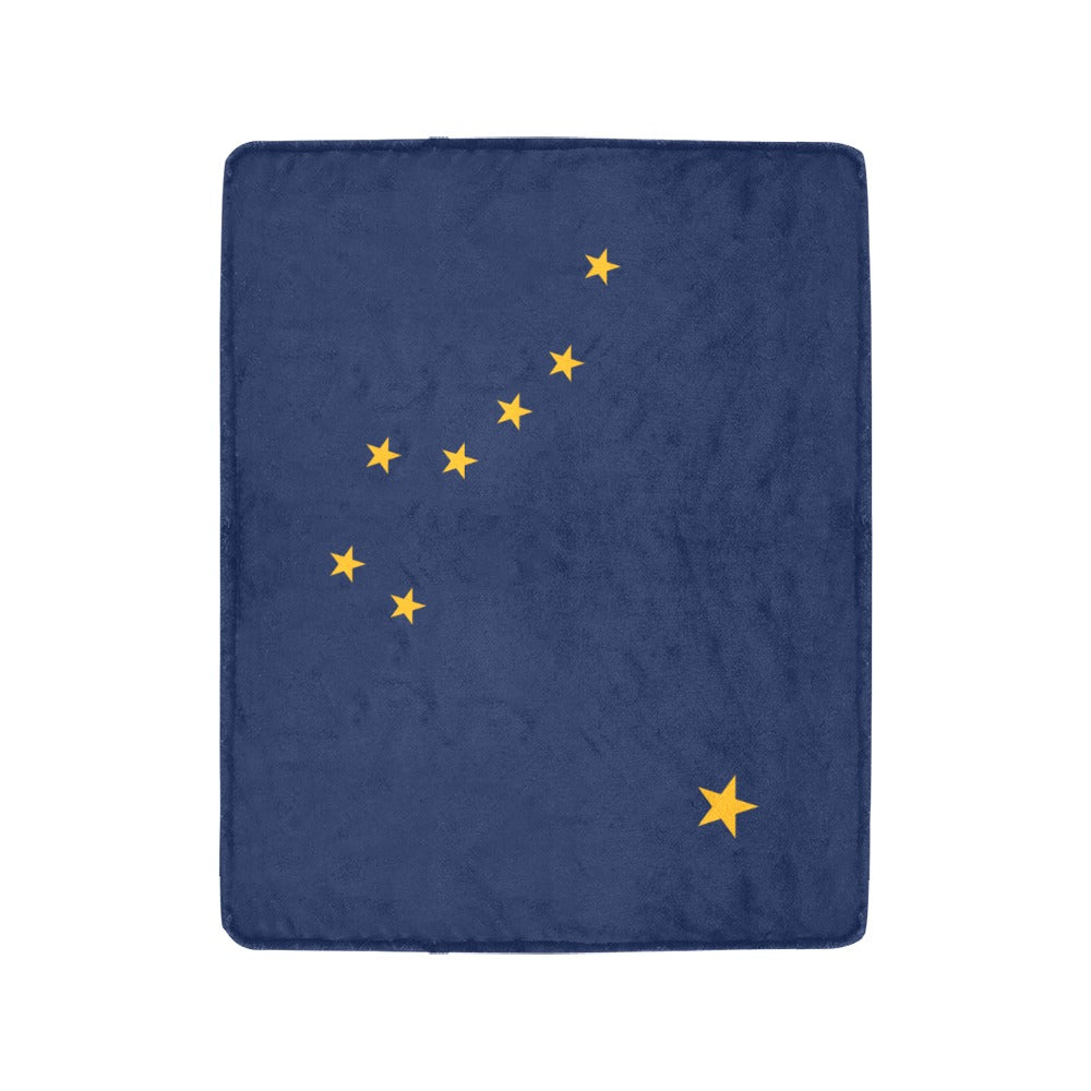 Navy blanket with yellow stars, representing Luv My Flag.