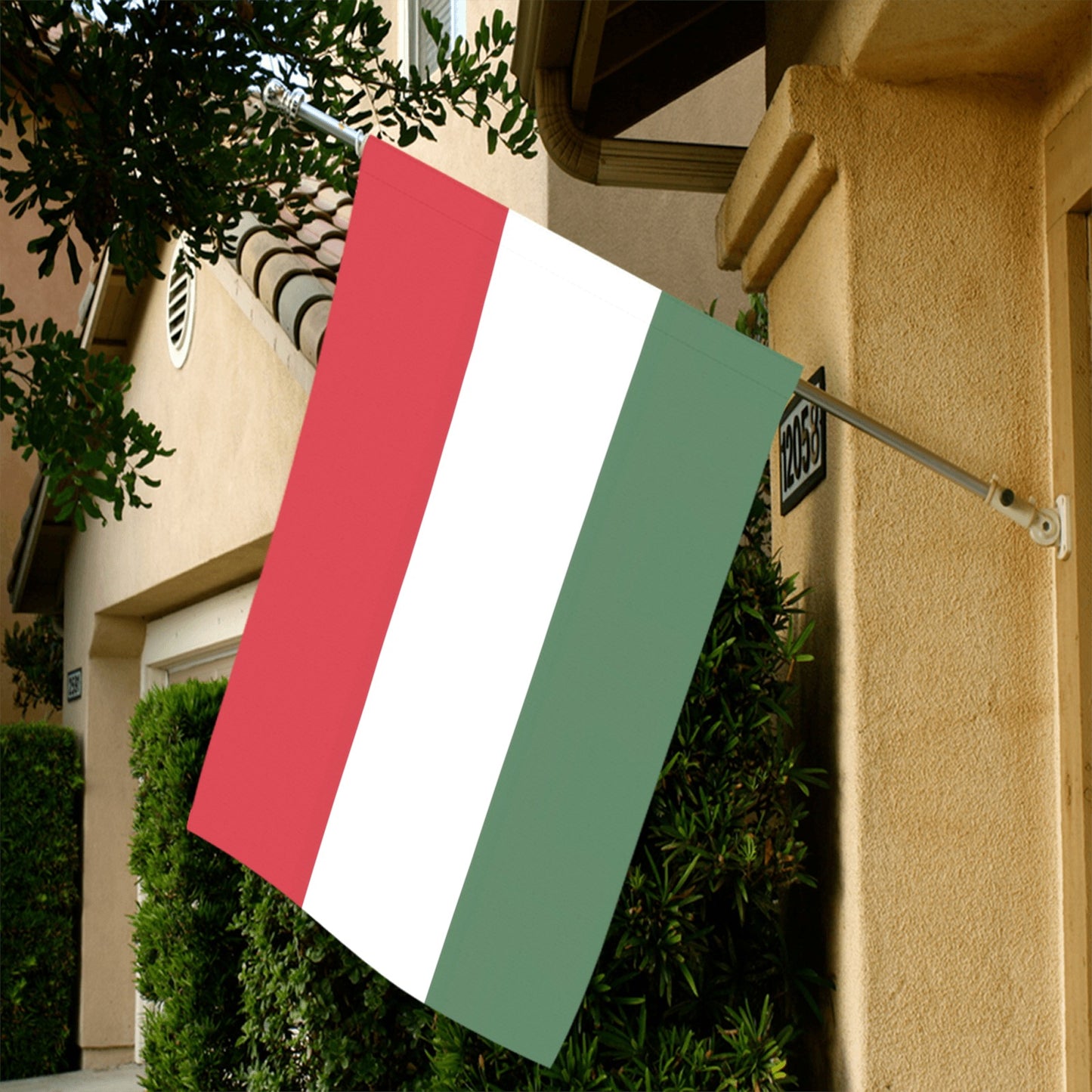 Luv My Flag Italian flag displayed on beige house.