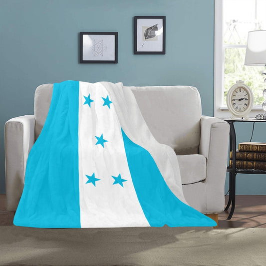 Cozy couch with Luv My Flag blanket, star design.