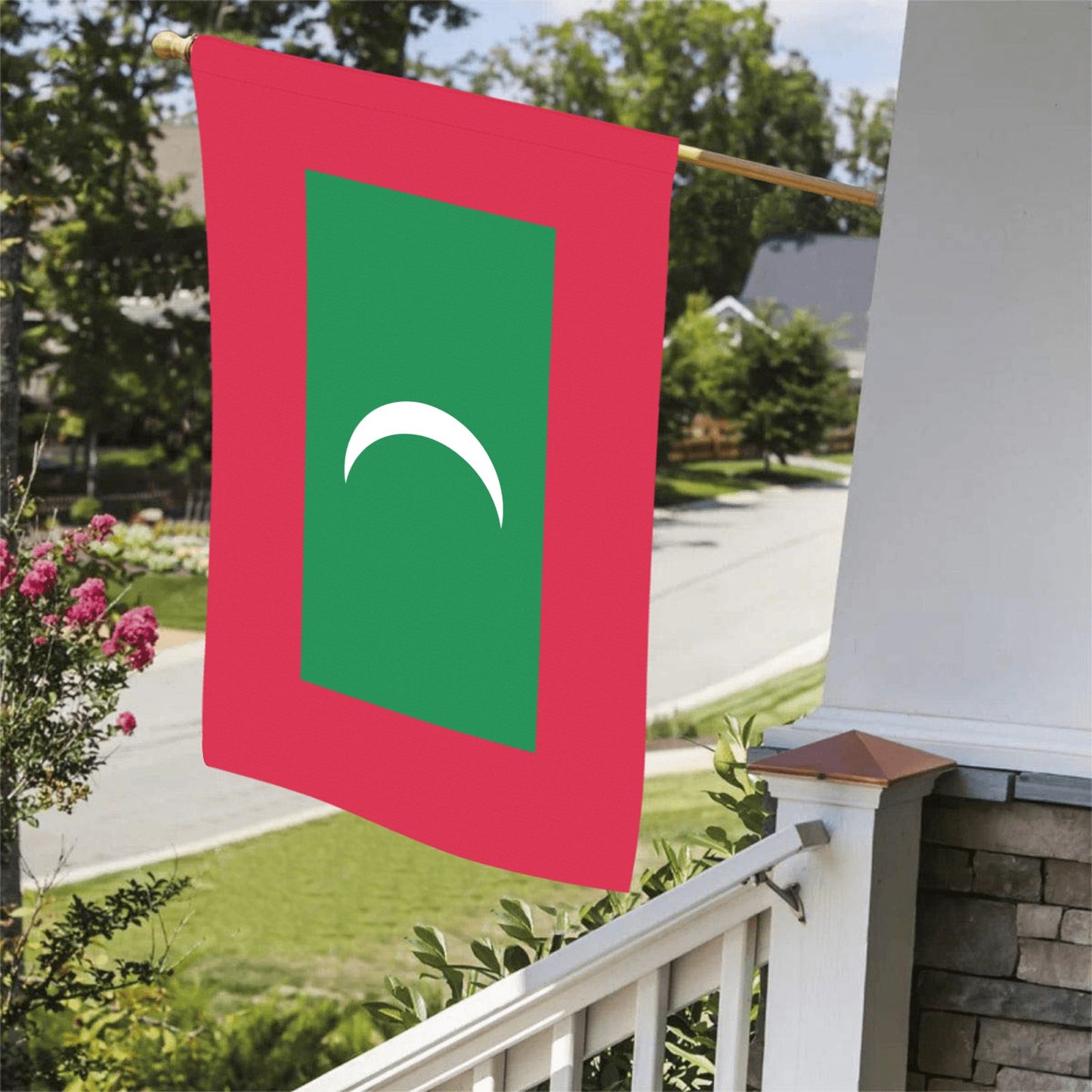 Red and green Luv My Flag displayed on porch.