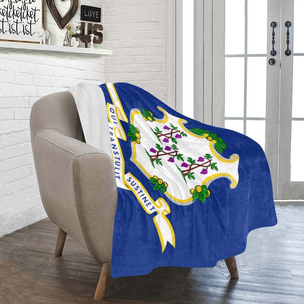 Cozy chair draped with Luv My Flag Connecticut blanket.