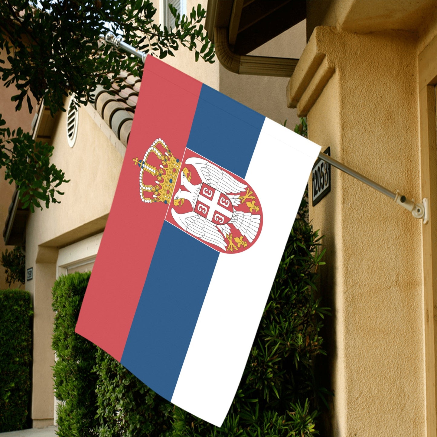 Luv My Flag: Serbian flag displayed outside a beige house.