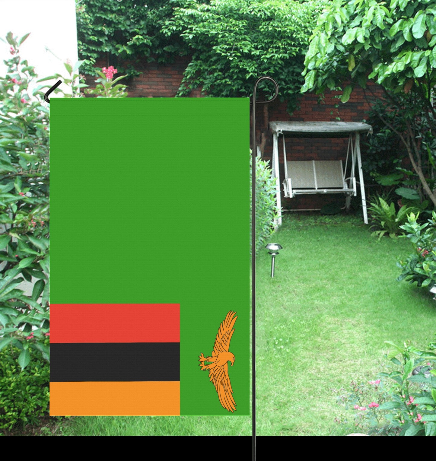 Garden scene featuring Luv My Flag's colorful banner.