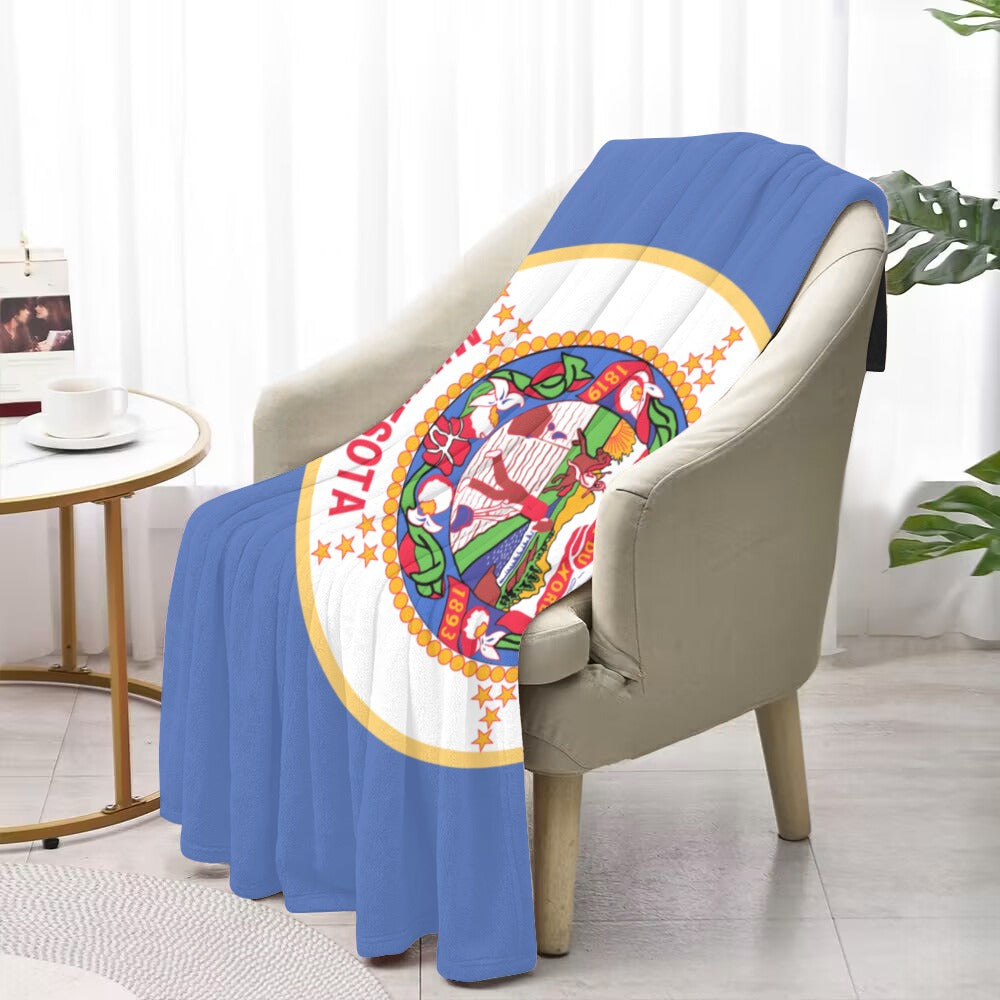 Luv My Flag decorative Minnesota throw draped over armchair.