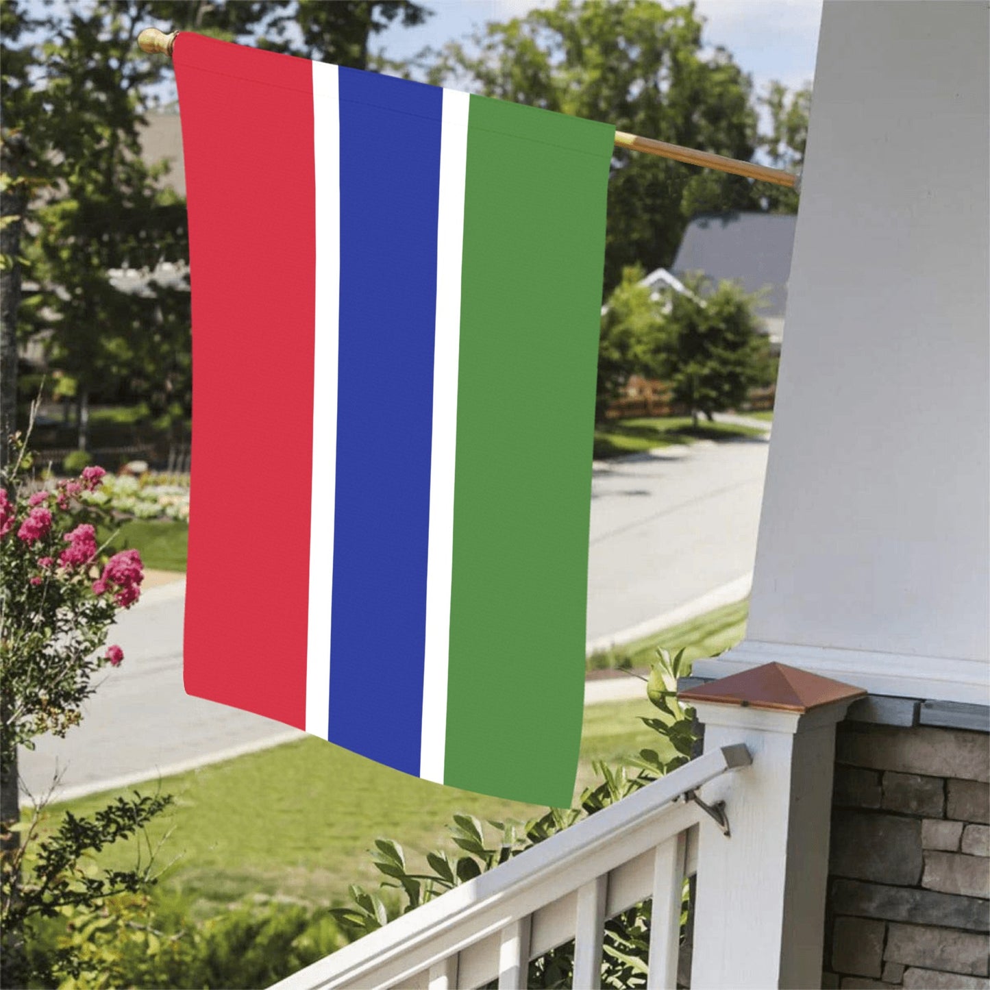 Luv My Flag hanging on porch, red, blue, green stripes.