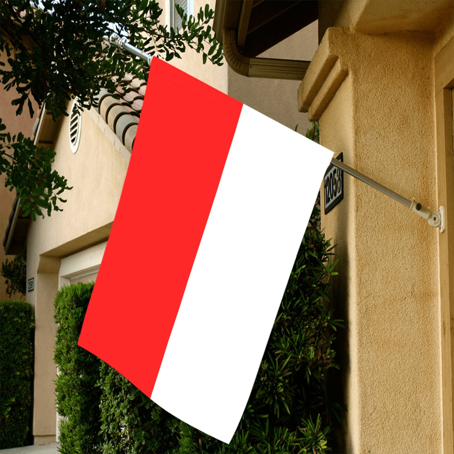 Red and white flag by Luv My Flag, outdoor setting.