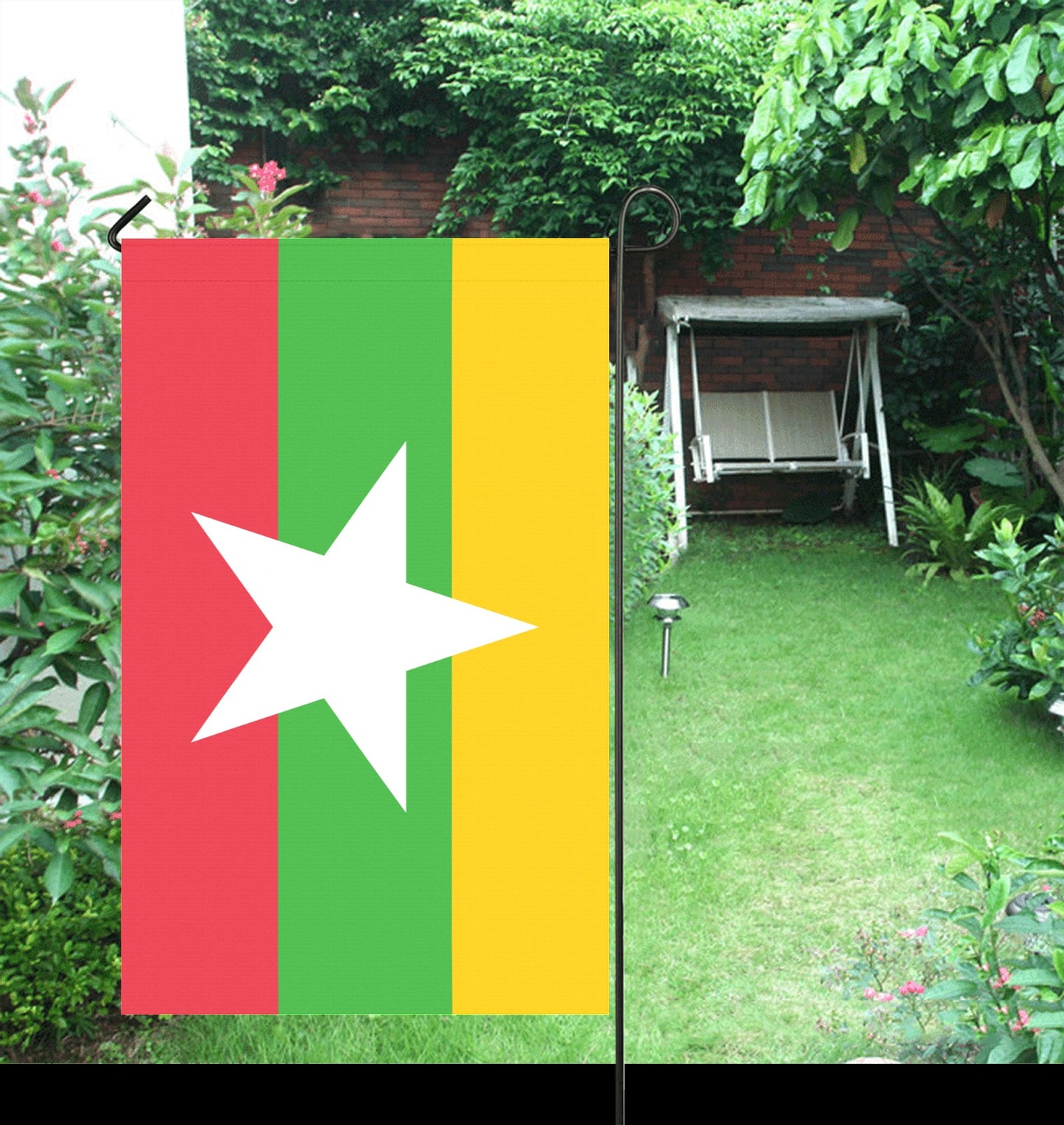 Luv My Flag garden banner with colorful stripes displayed outdoors.