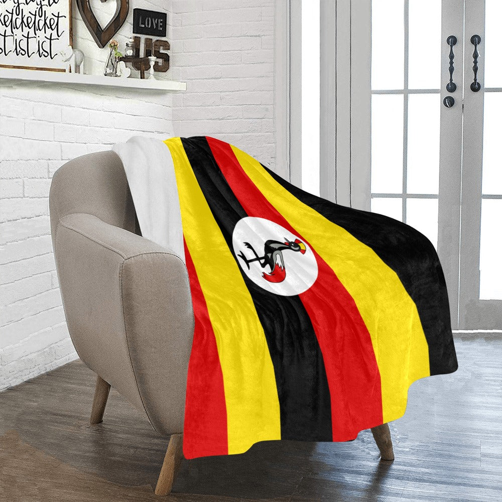 Cozy chair draped with Luv My Flag Ugandan blanket.