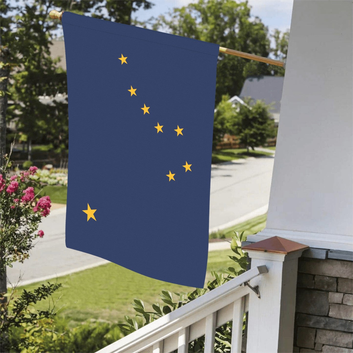 Luv My Flag: Alaska flag displayed on porch railing.