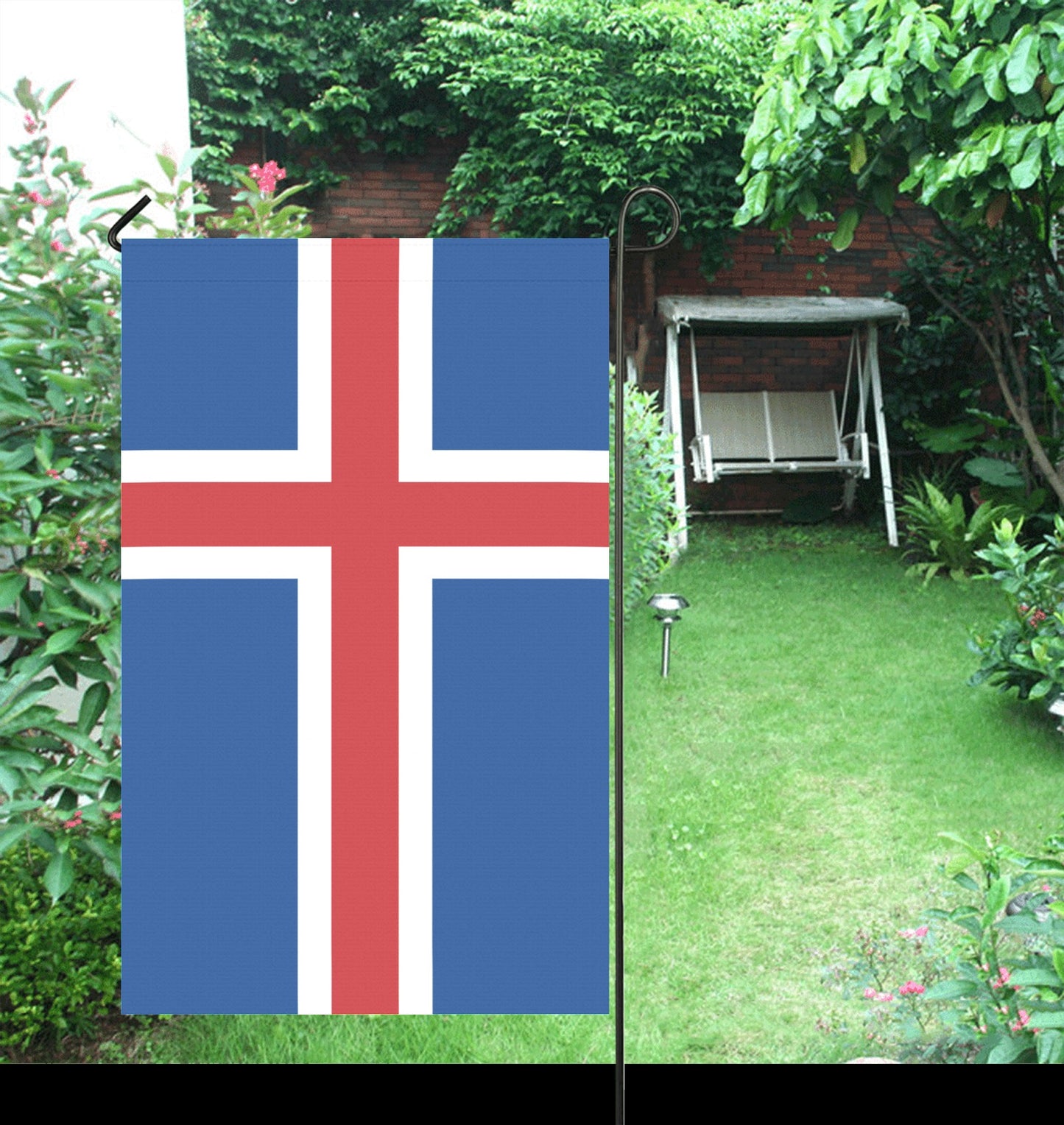 Outdoor garden with Luv My Flag Icelandic flag displayed.