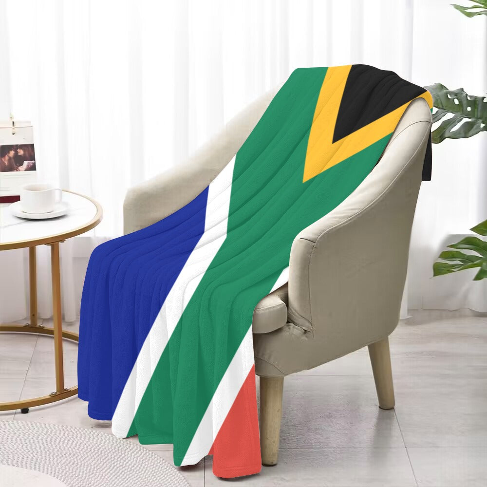 Luv My Flag blanket draped over chair, South African design.