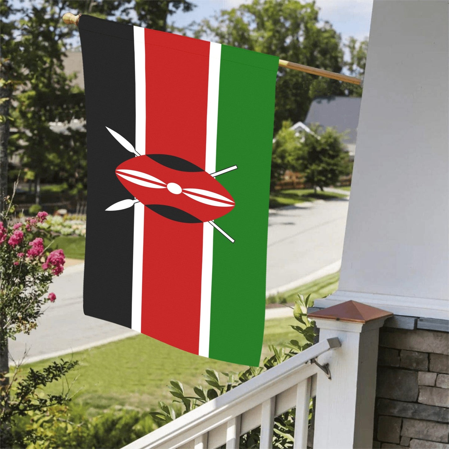 Kenyan flag by Luv My Flag hangs on porch.