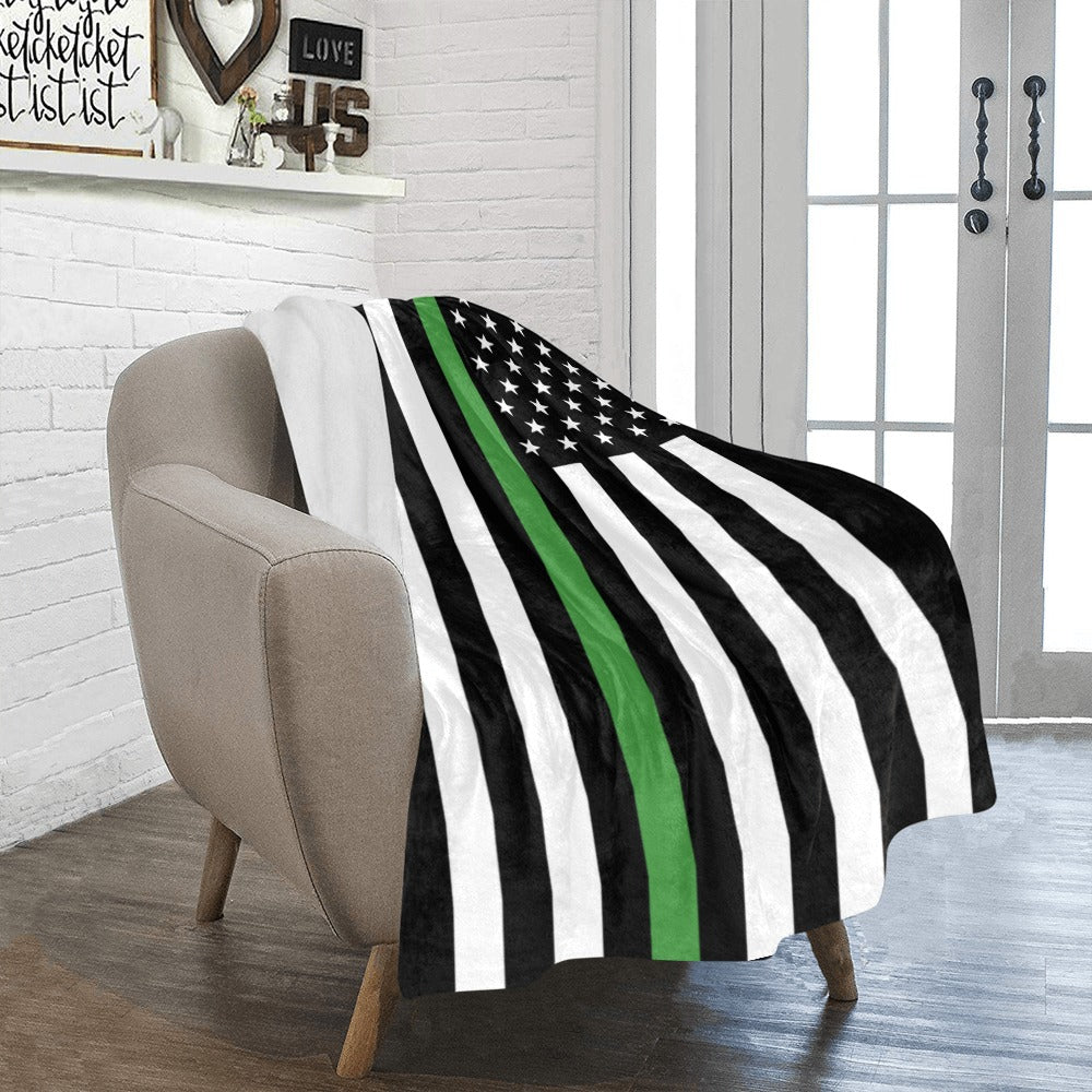 Cozy armchair with Luv My Flag black-green flag blanket.