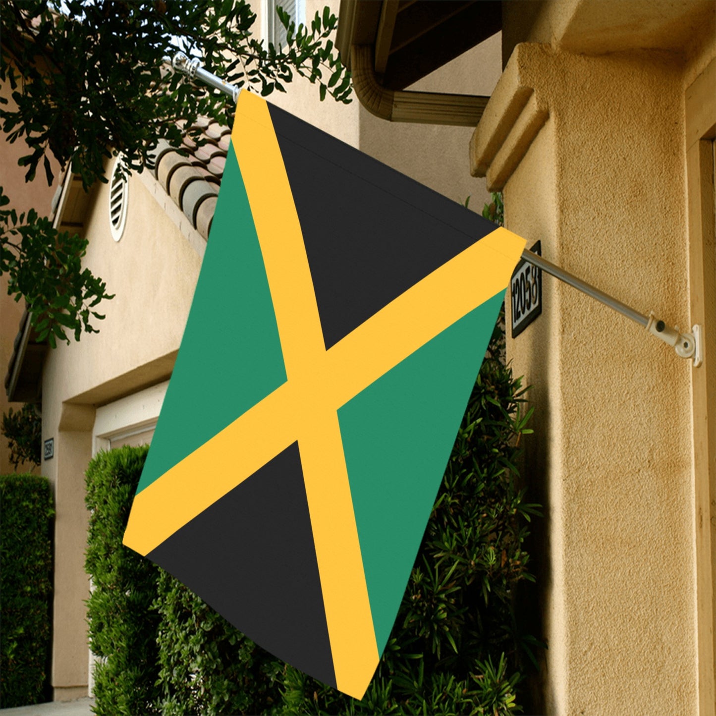 House displaying Jamaican flag by Luv My Flag brand.
