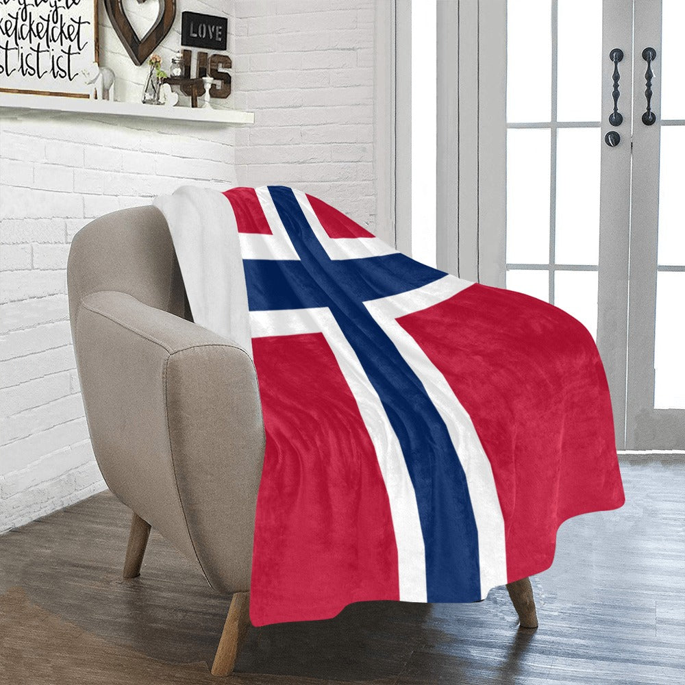 Cozy chair adorned with Luv My Flag Norwegian blanket.