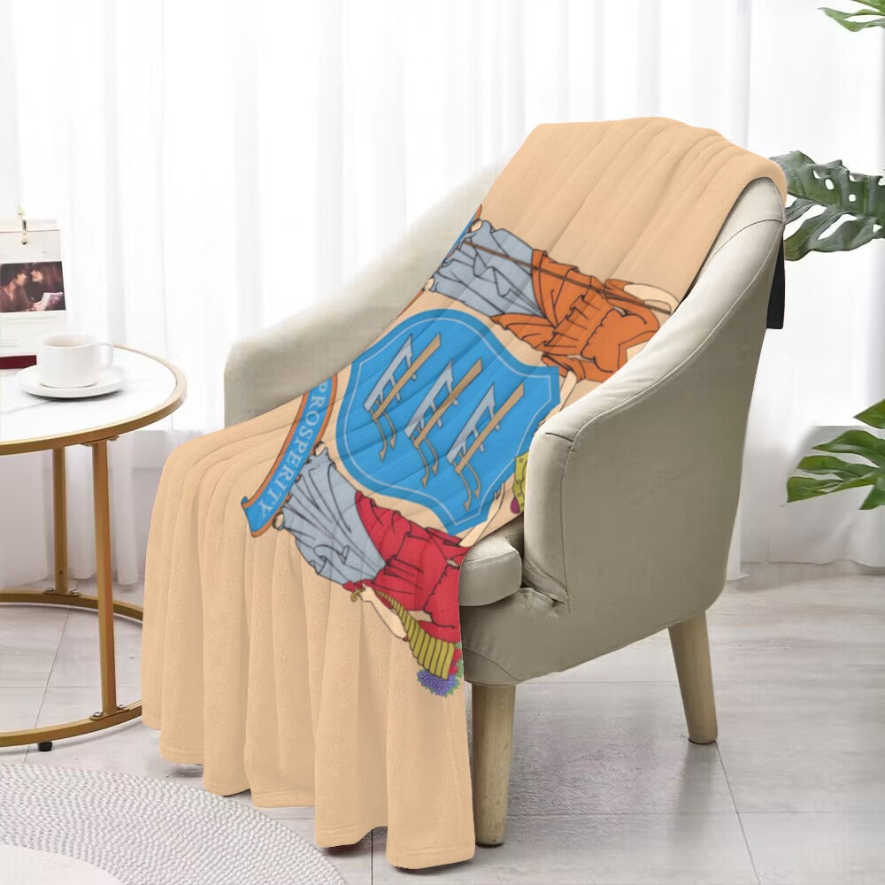 Cozy armchair with Luv My Flag branded blanket draped.