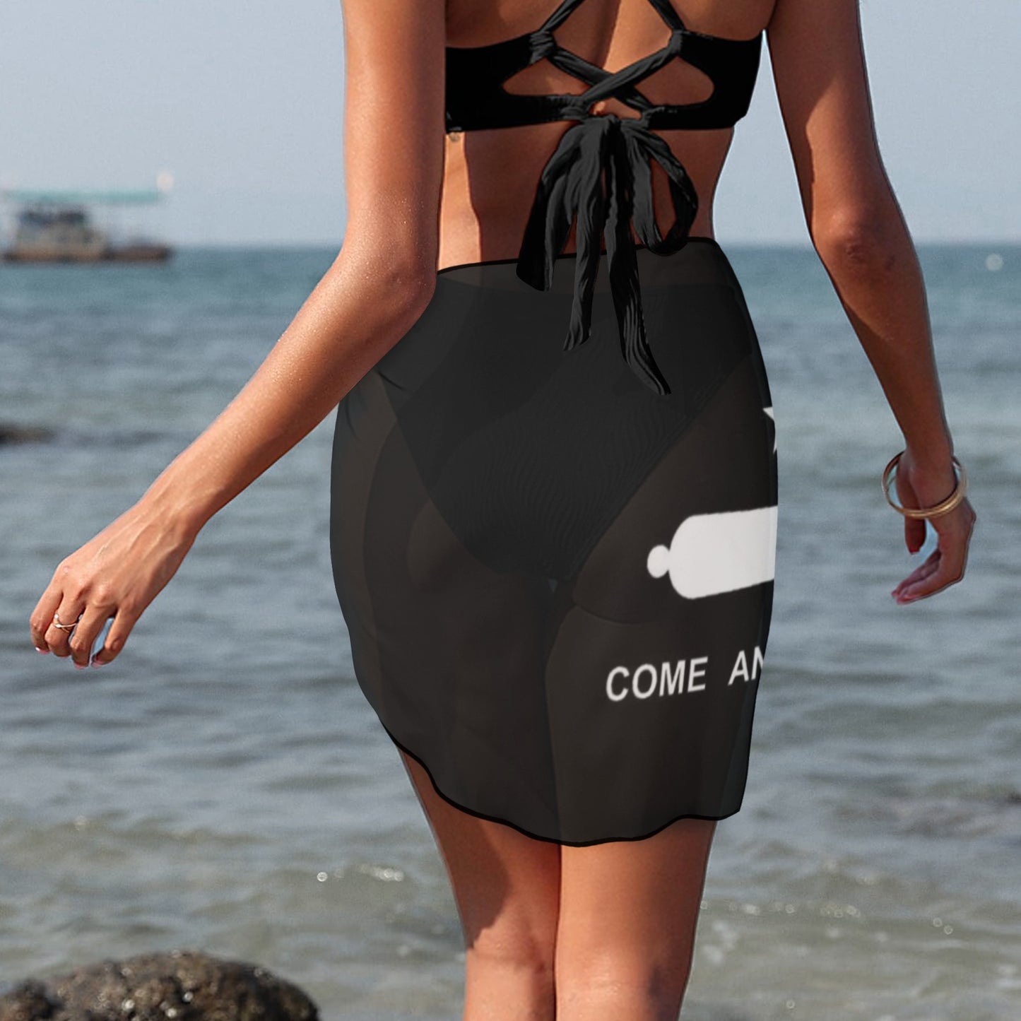 Woman wearing black beachwear sarong, ocean background, Luv My Flag.