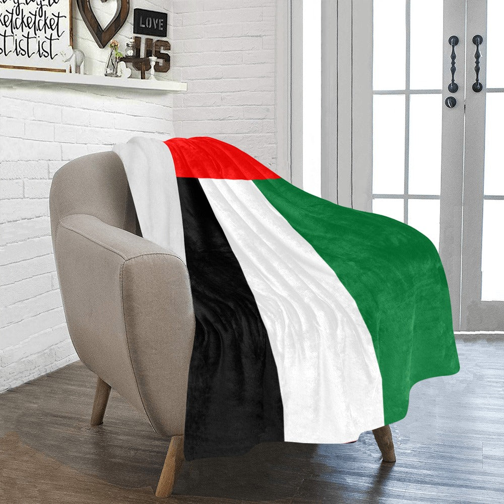 Cozy chair draped with Luv My Flag colored blanket.