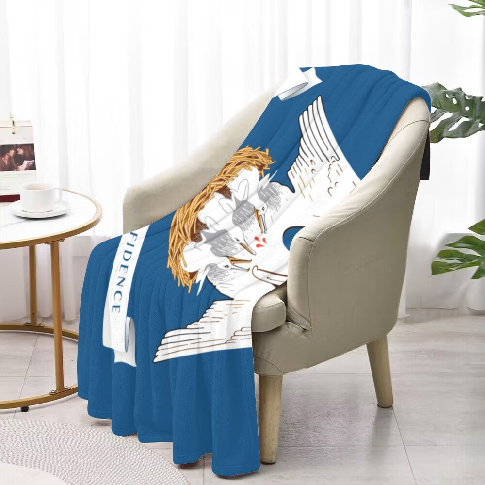 Blue blanket with Luv My Flag brand design draped over chair.