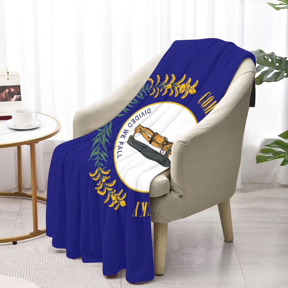 Chair draped with Luv My Flag Kentucky-themed blue blanket.
