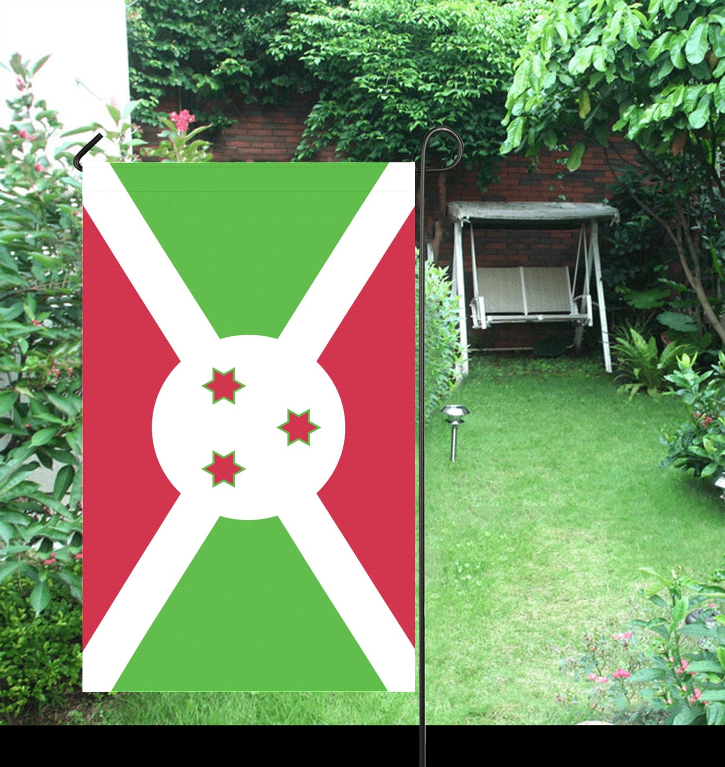 Luv My Flag garden flag with Burundian design in garden.