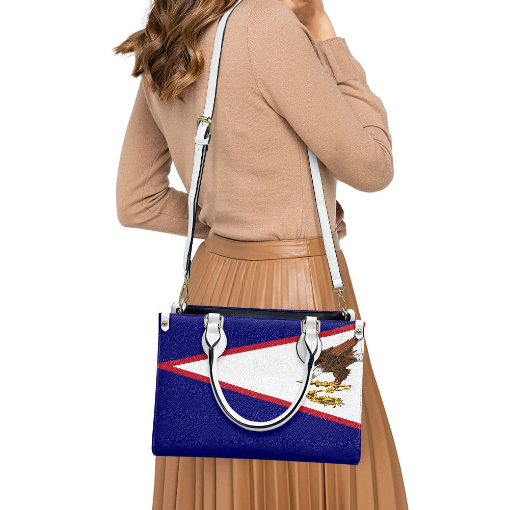 Woman carrying Luv My Flag handbag with patriotic design.